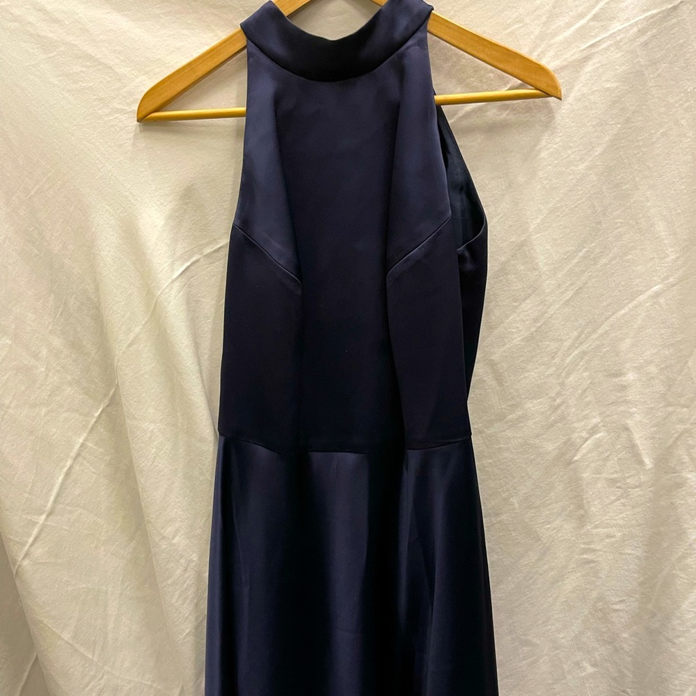 Navy silk halter knee length cocktail dress. Low back, w back bow. Never worn.